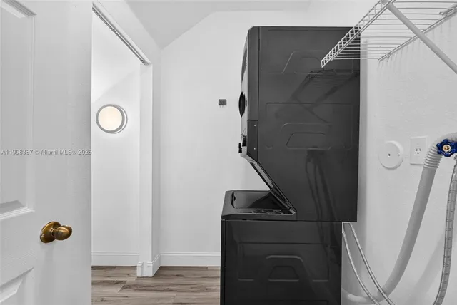 a view of a big house with a yard and plants