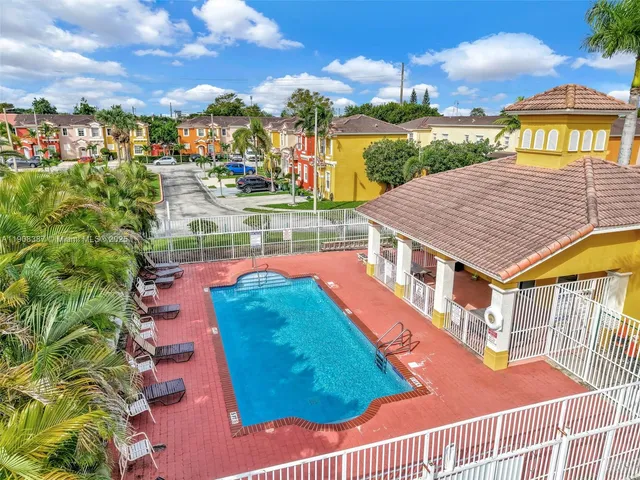 aerial view of a house with a yard