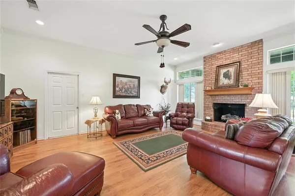 a living room with furniture or couch and a fireplace