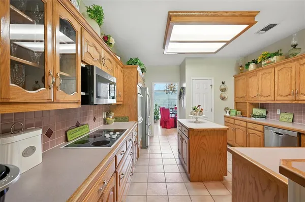 a kitchen that has a sink and a stove
