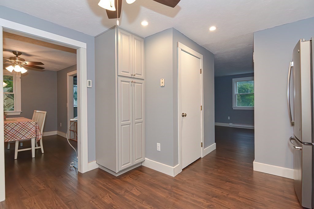 12 Oxbow Road Charlton, MA 01507 - Photo 15 of 40 a view of a hallway with wooden floor and a bathroom