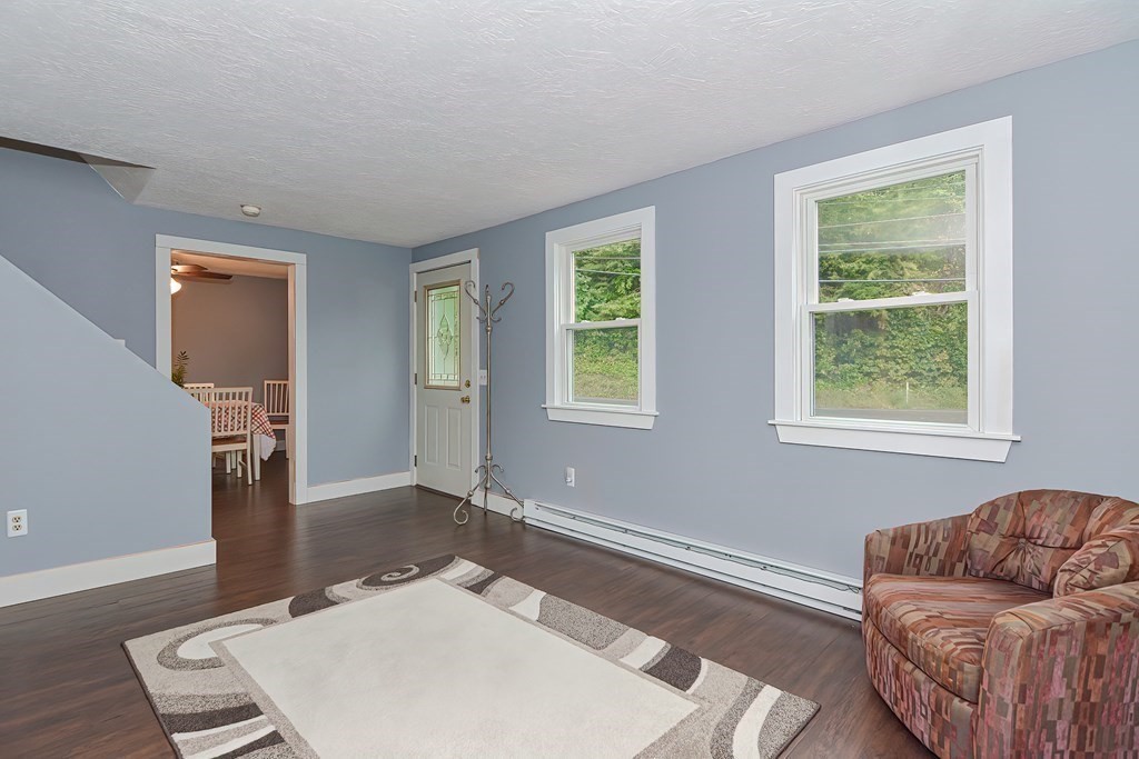 12 Oxbow Road Charlton, MA 01507 - Photo 16 of 40 a living room with furniture and a window