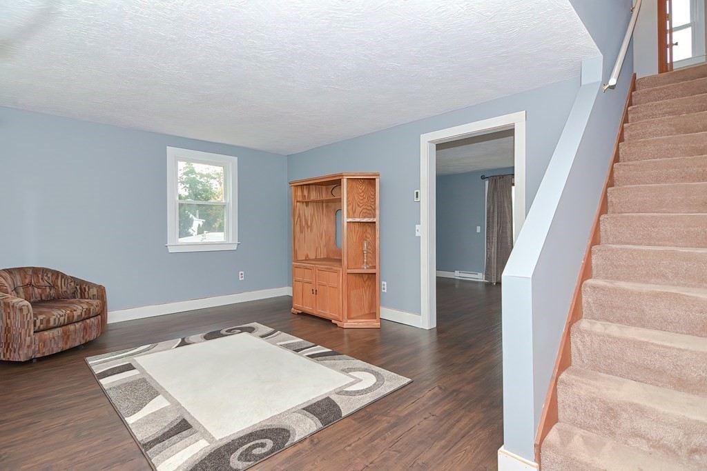 12 Oxbow Road Charlton, MA 01507 - Photo 17 of 40 a living room with furniture and a window