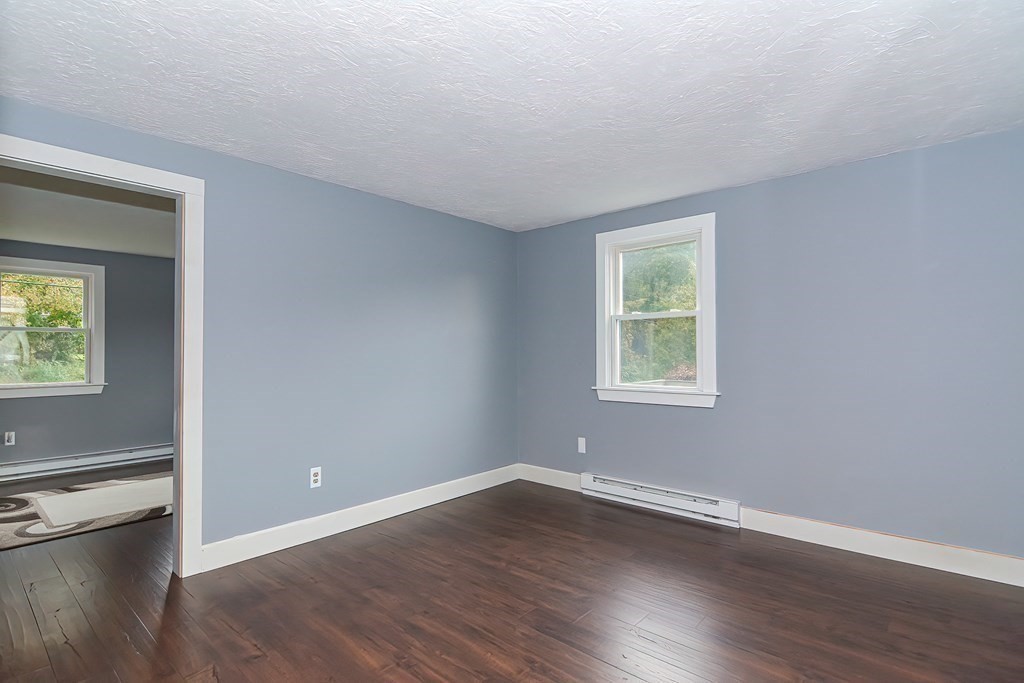 12 Oxbow Road Charlton, MA 01507 - Photo 20 of 40 a view of a room with wooden floor and windows