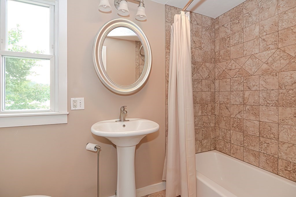 12 Oxbow Road Charlton, MA 01507 - Photo 30 of 40 a bathroom with a sink a mirror and a bathtub