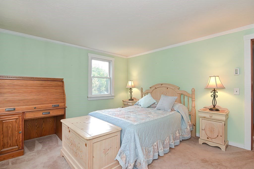 12 Oxbow Road Charlton, MA 01507 - Photo 34 of 40 a bedroom with a bed and a table