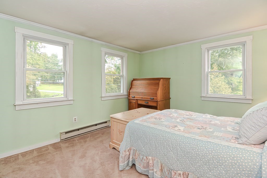 12 Oxbow Road Charlton, MA 01507 - Photo 35 of 40 a bedroom with a bed and wooden floor
