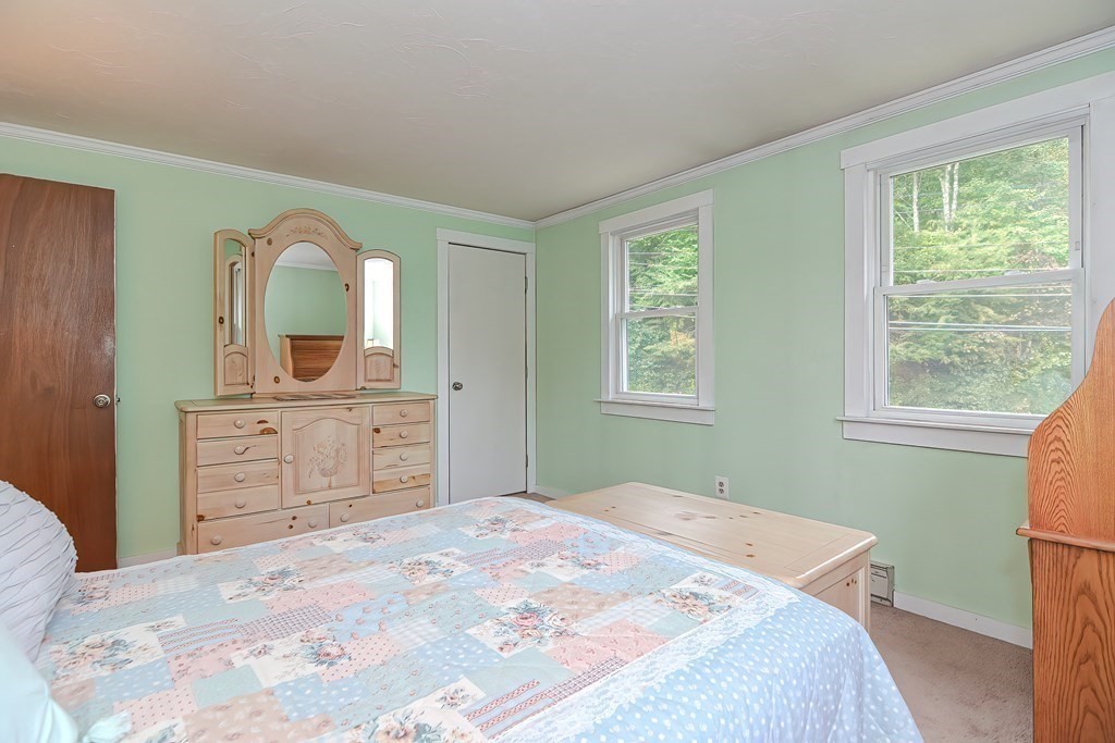 12 Oxbow Road Charlton, MA 01507 - Photo 36 of 40 a bedroom with a bed and a dresser
