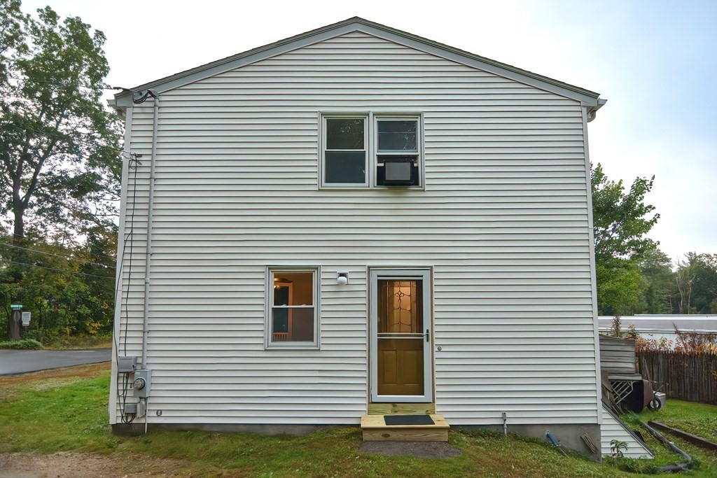 12 Oxbow Road Charlton, MA 01507 - Photo 4 of 40 a view of a house with a yard and a large window