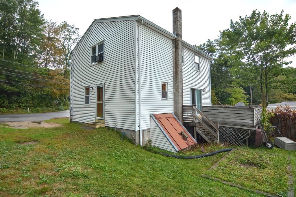 12 Oxbow Road Charlton, MA 01507 - Photo 5 of 40 a view of a house with two chairs in a patio