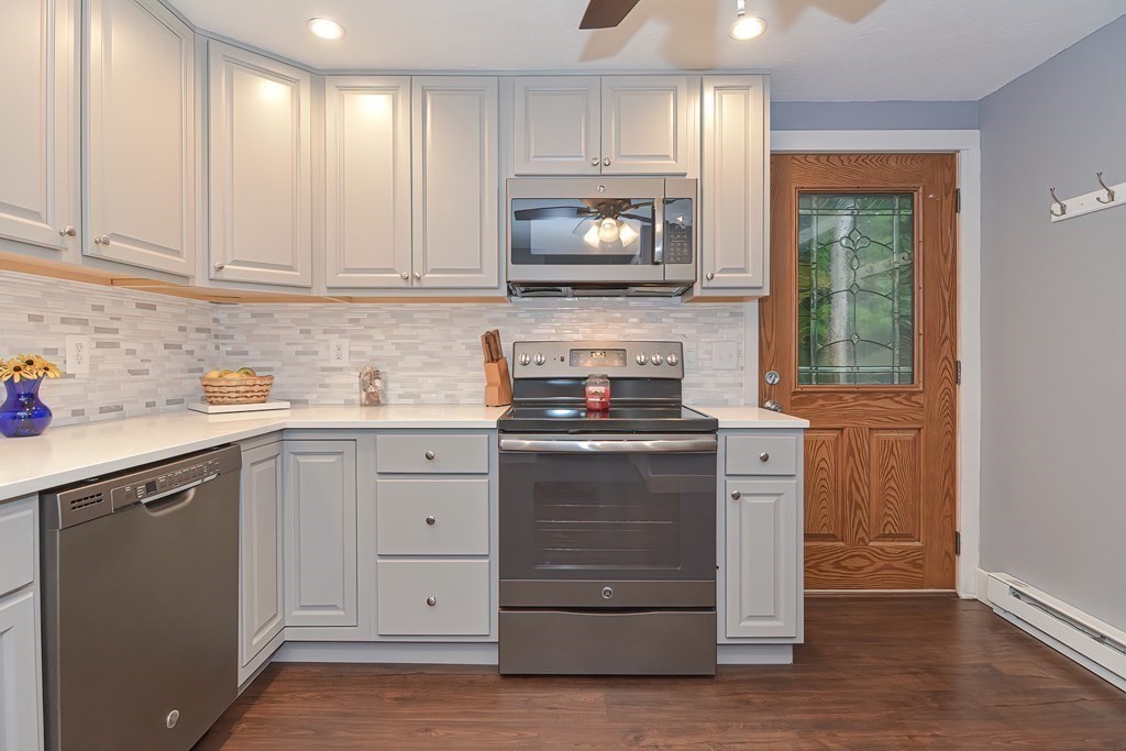 12 Oxbow Road Charlton, MA 01507 - Photo 6 of 40 a kitchen with white cabinets and sink