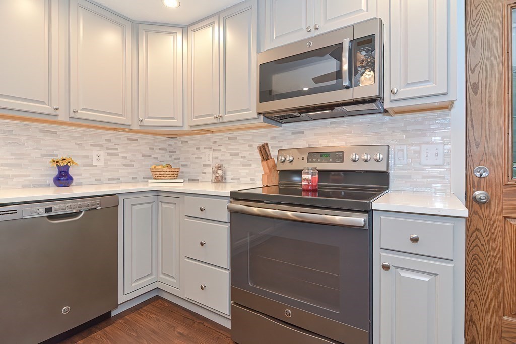 12 Oxbow Road Charlton, MA 01507 - Photo 8 of 40 a kitchen with white cabinets stainless steel appliances and sink
