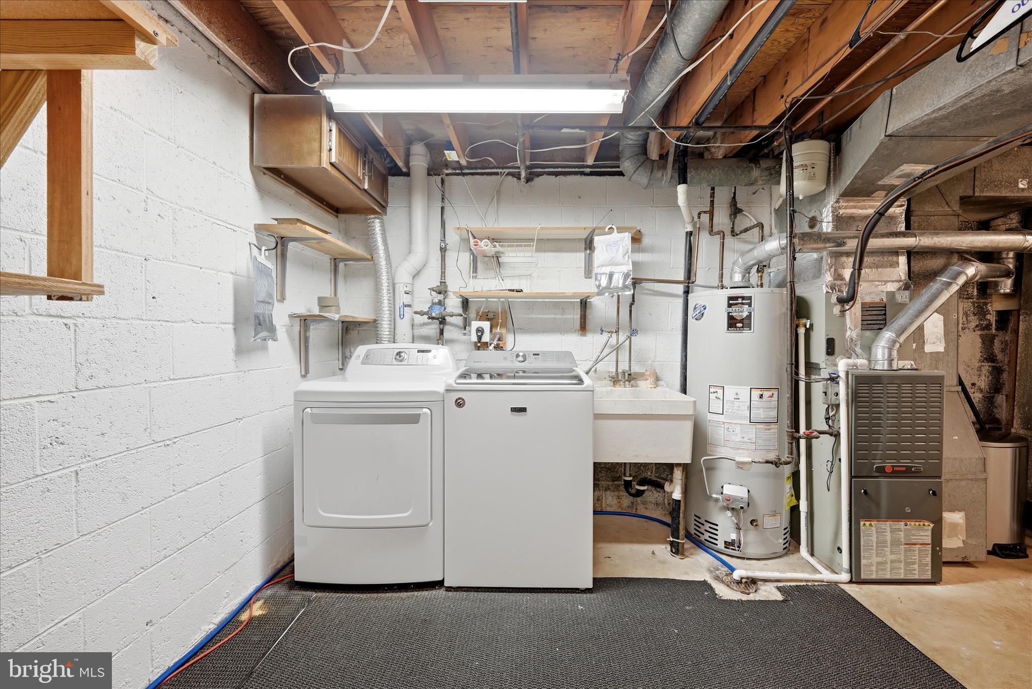 5446 Lighthouse Lane Burke, VA 22015 - Photo 29 of 36 a utility room with dryer and washer