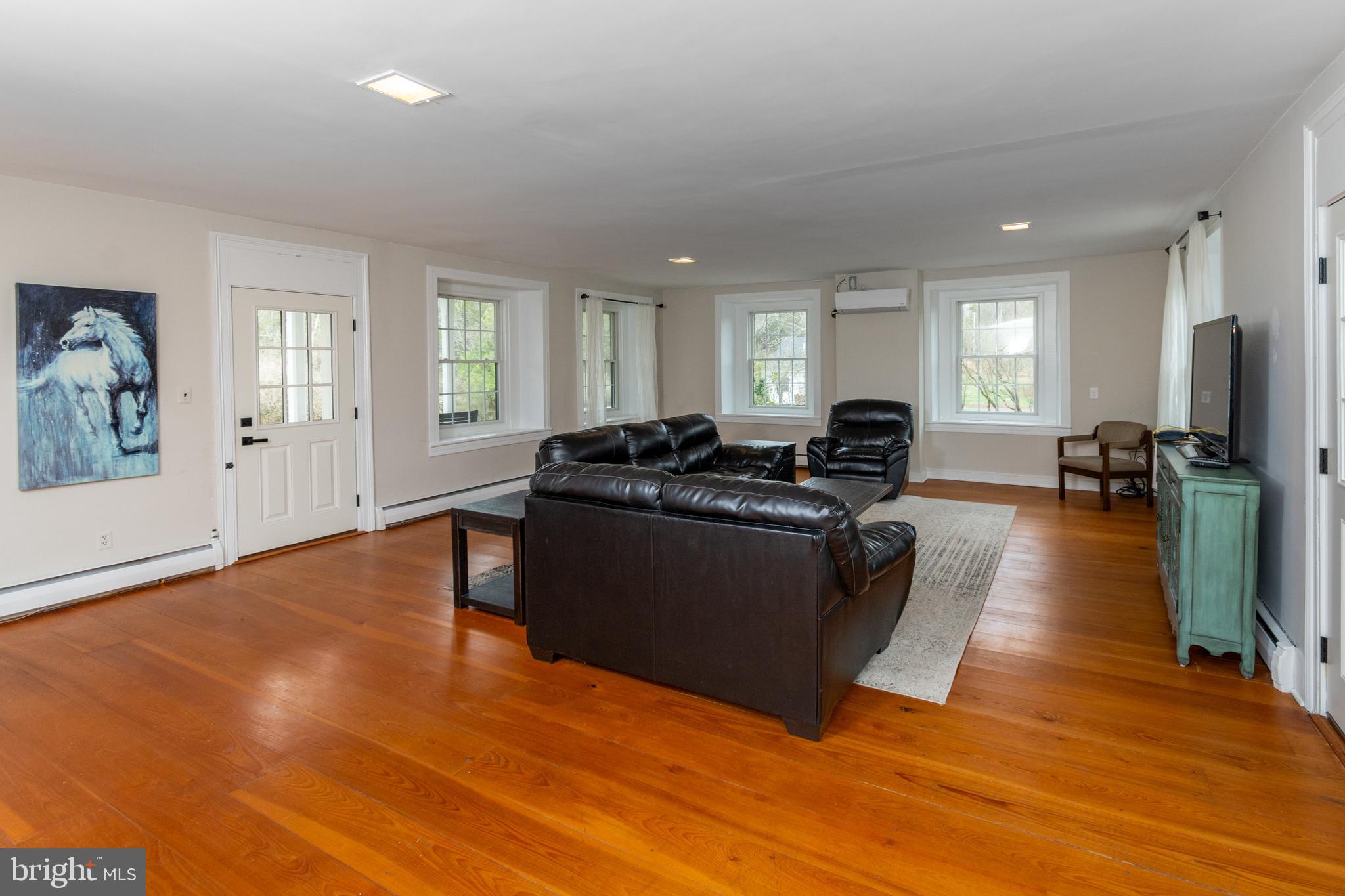 180 Municipal Road Pipersville, PA 18947 - Photo 14 of 60 a living room with furniture and a flat screen tv