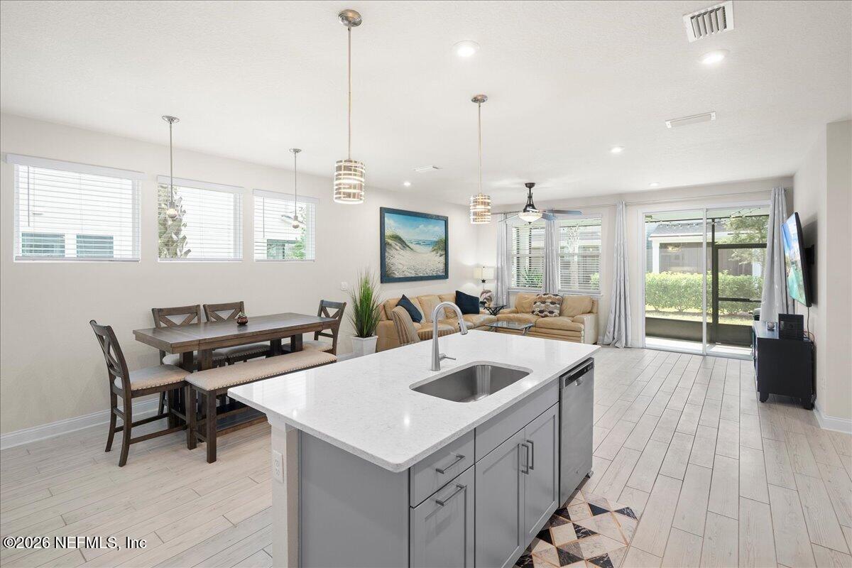 14158 Backbarrier Road Jacksonville, FL 32224 - Photo 8 of 31 Kitchen island with quartz countertops