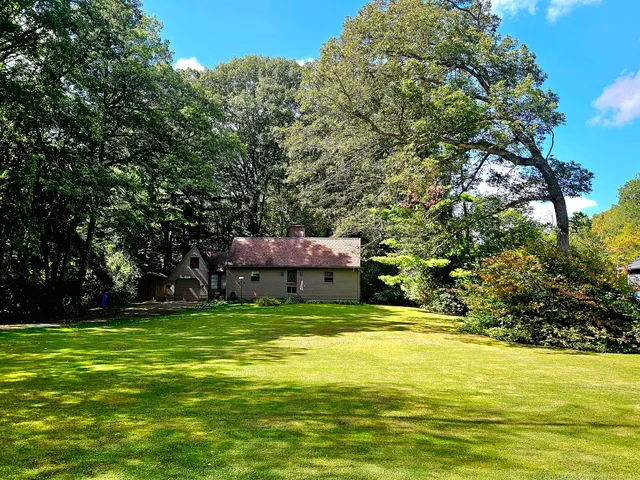 a swimming pool with trees in the background