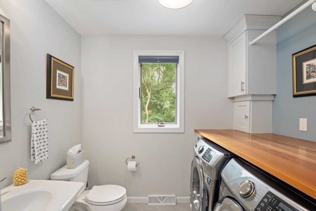 16 A Garvey Road Framingham, MA 01701 - Photo 10 of 41 a bathroom with a sink a toilet and a window
