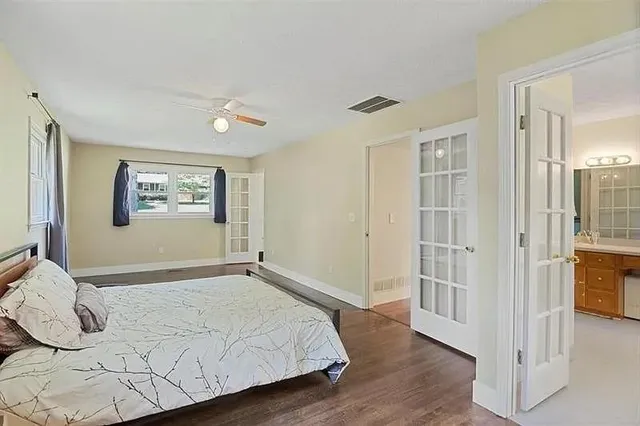 a bedroom with a bed and a window