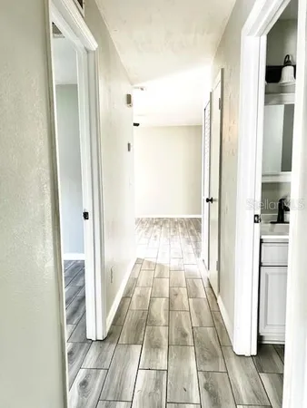 a view of a bathroom from the hallway
