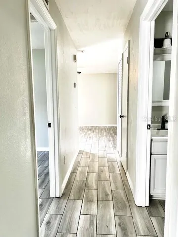 a view of a bathroom from the hallway