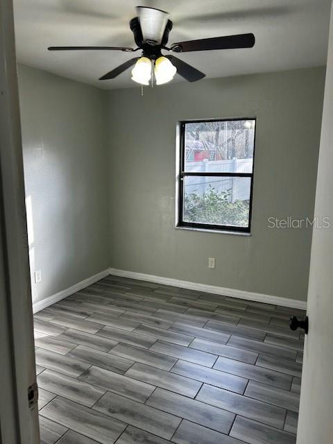 37 Cedar Tree Terrace Ocala, FL 34472 - Photo 15 of 21 a view of an empty room with wooden floor and a window