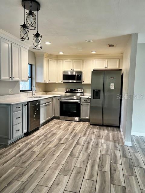 37 Cedar Tree Terrace Ocala, FL 34472 - Photo 5 of 21 a kitchen with stainless steel appliances granite countertop a stove top oven a refrigerator and a sink