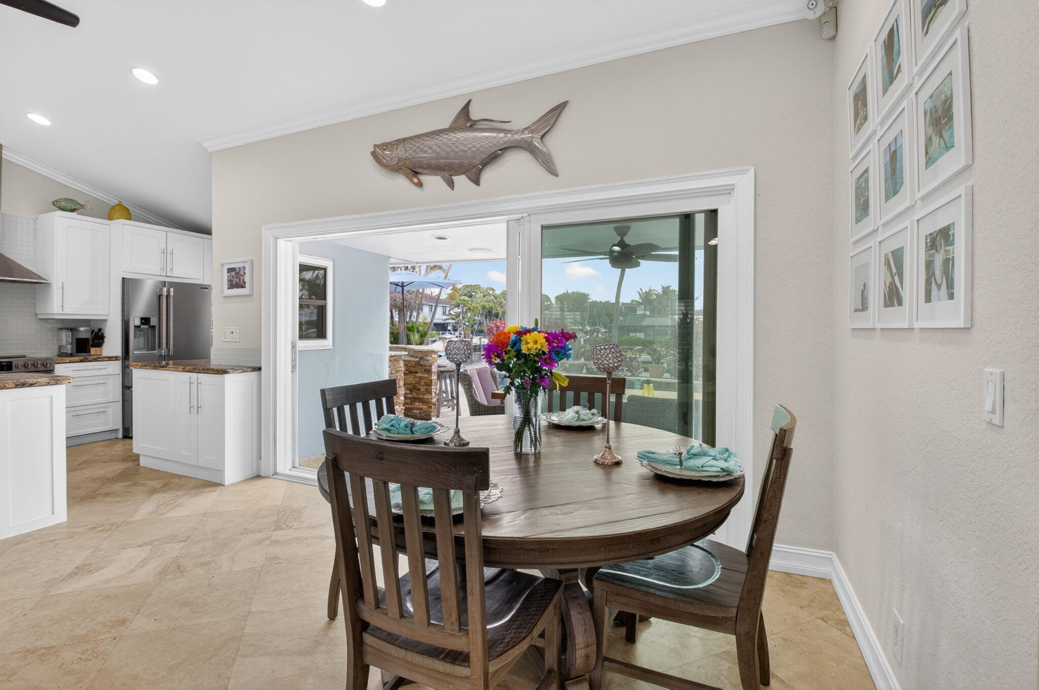 5800 Northeast 7th Avenue Boca Raton, FL 33487 - Photo 14 of 61 a view of a dining room with furniture large window and wooden floor