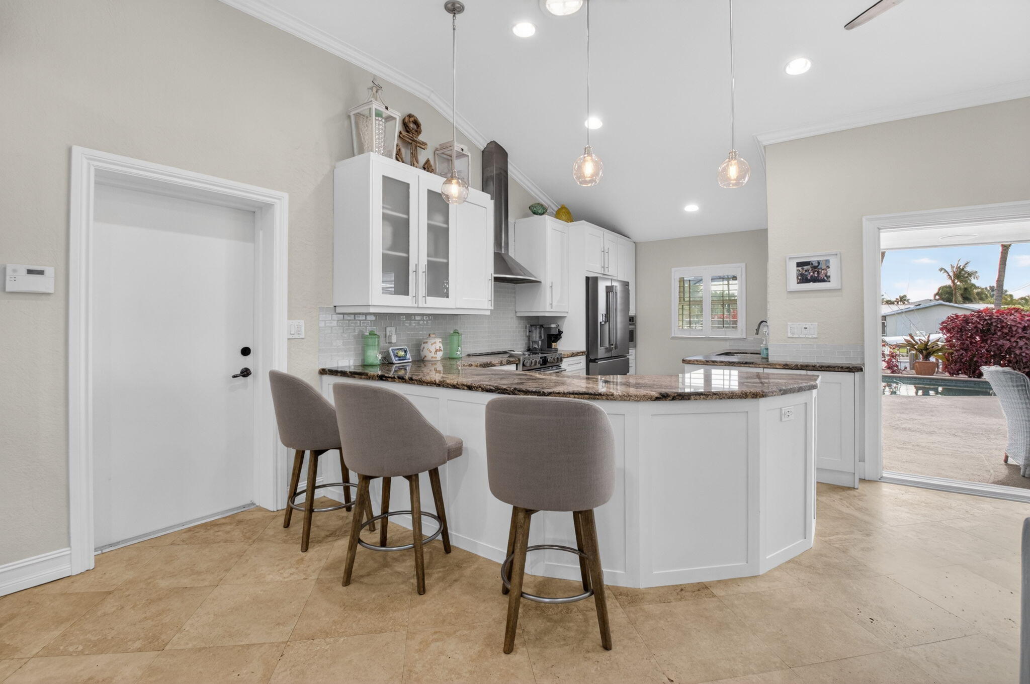 5800 Northeast 7th Avenue Boca Raton, FL 33487 - Photo 15 of 61 a kitchen with kitchen island granite countertop lots of counter top space and furniture