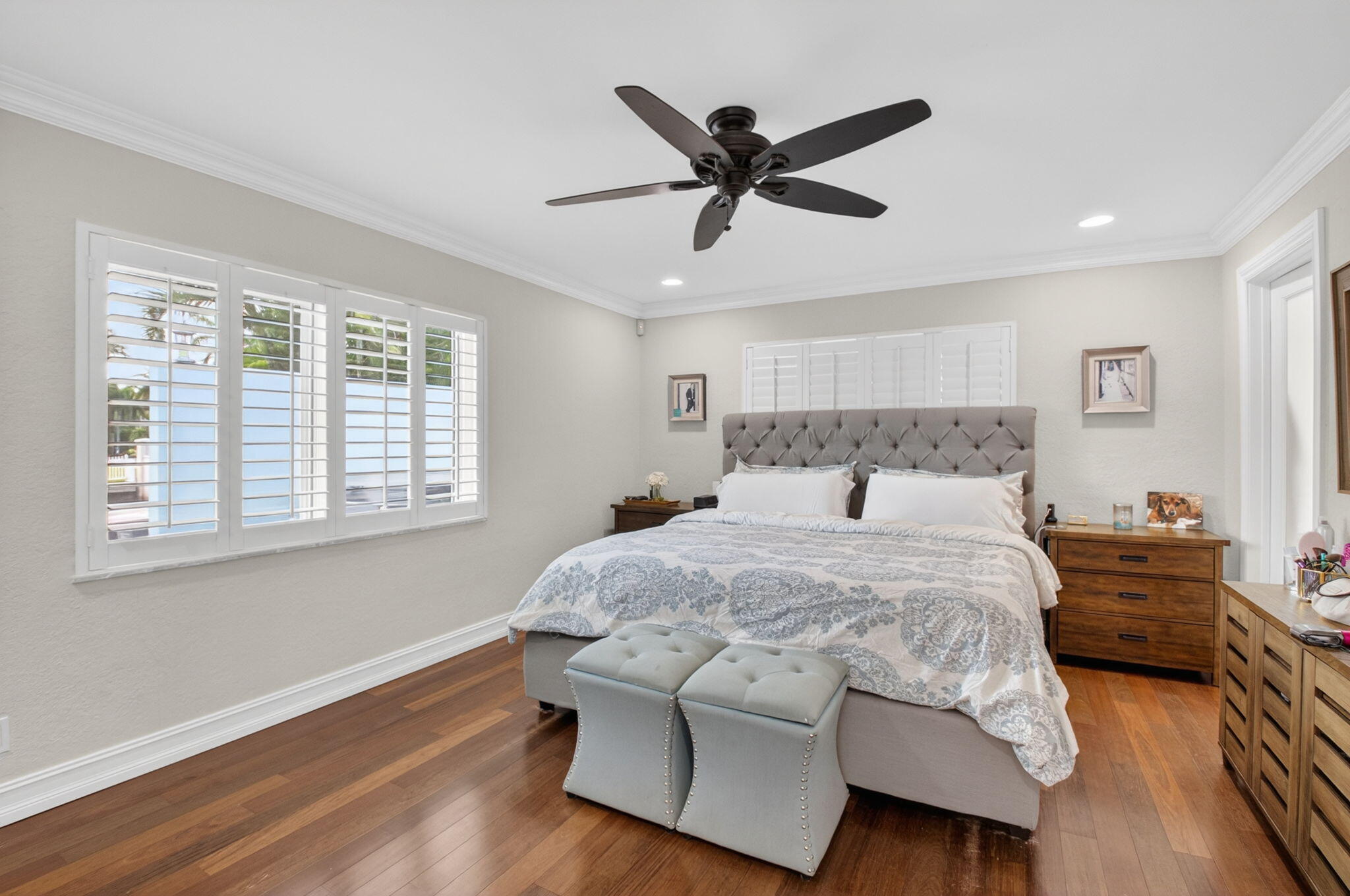 5800 Northeast 7th Avenue Boca Raton, FL 33487 - Photo 26 of 61 a bedroom with a bed and wooden floor
