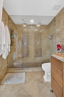 a view of a patio with couches and a fire pit