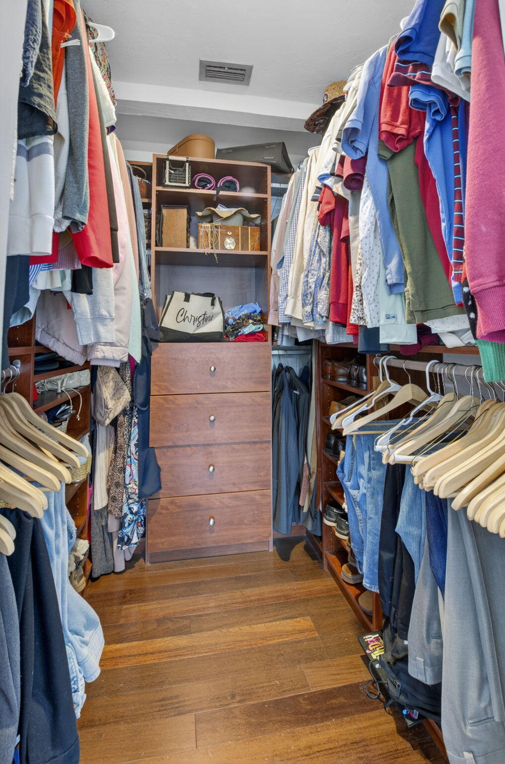 5800 Northeast 7th Avenue Boca Raton, FL 33487 - Photo 30 of 61 a view of walk in closet with clothes and shoes