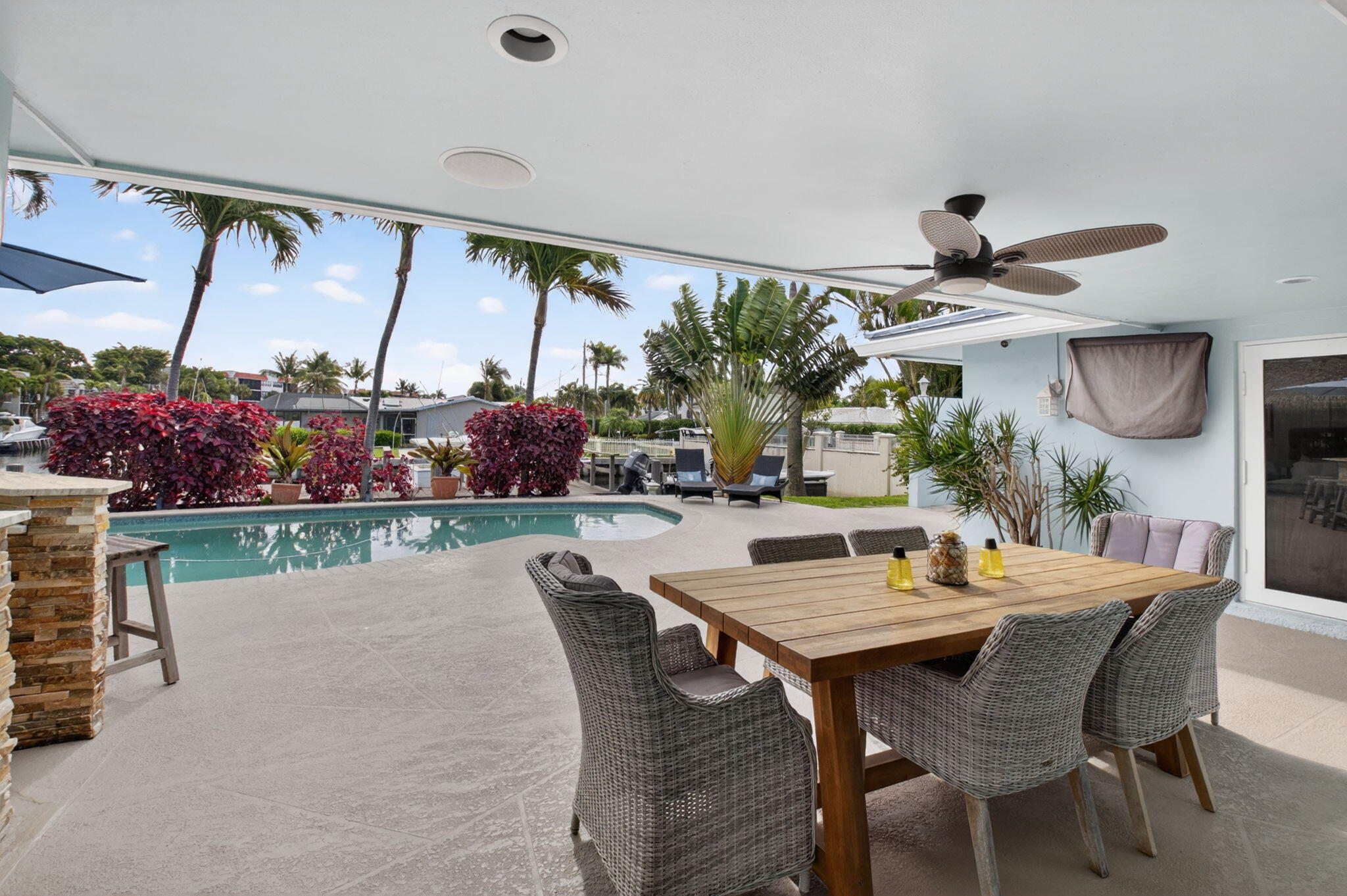 5800 Northeast 7th Avenue Boca Raton, FL 33487 - Photo 31 of 61 a dining room with a wooden table and chairs