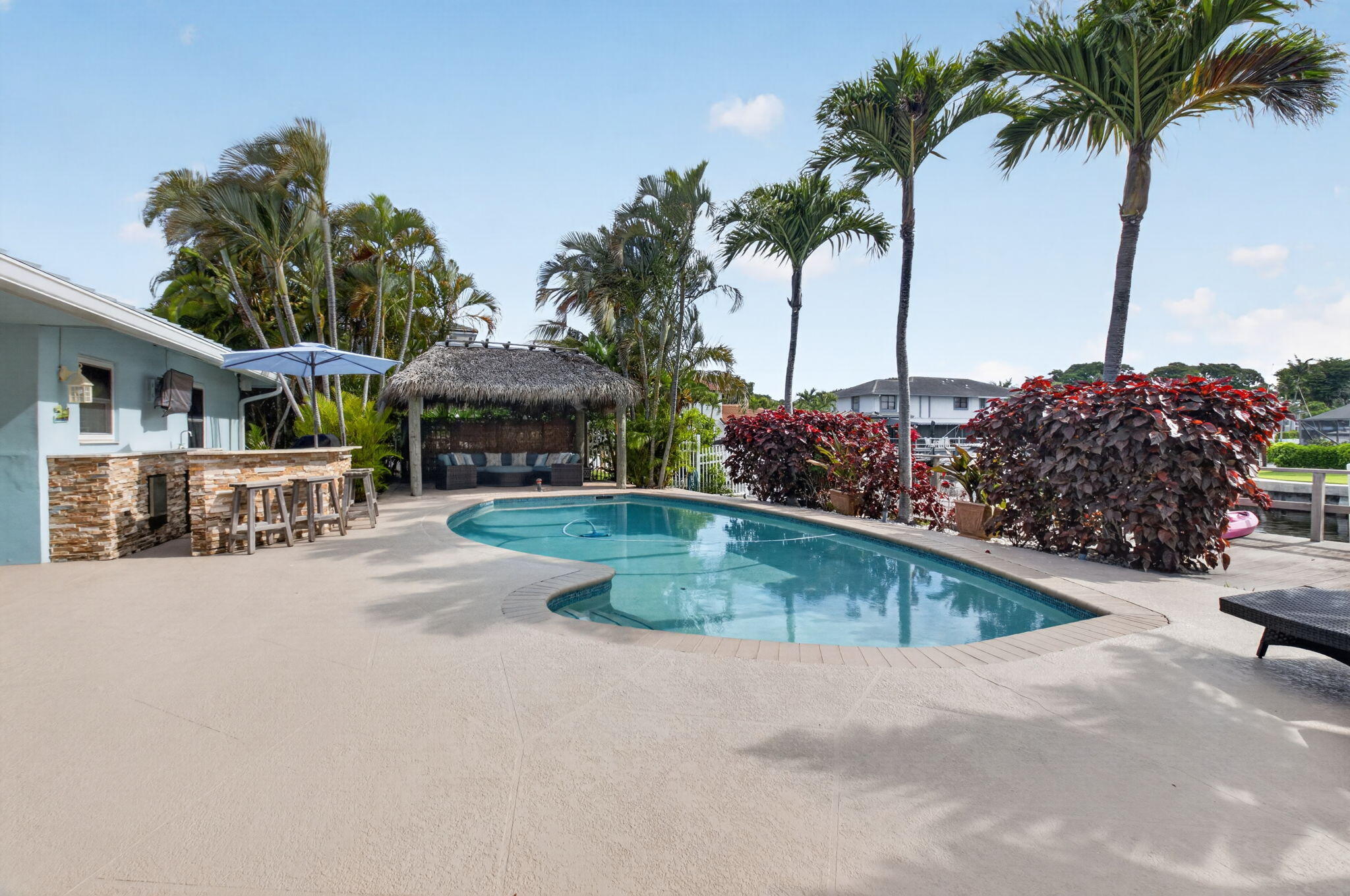5800 Northeast 7th Avenue Boca Raton, FL 33487 - Photo 33 of 61 a swimming pool with outdoor seating and yard