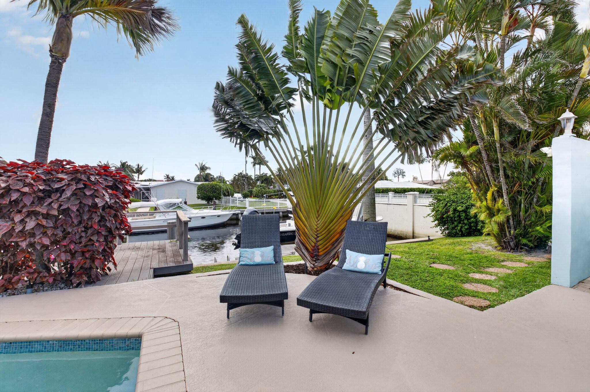 5800 Northeast 7th Avenue Boca Raton, FL 33487 - Photo 35 of 61 a view of a patio with couches and a fire pit