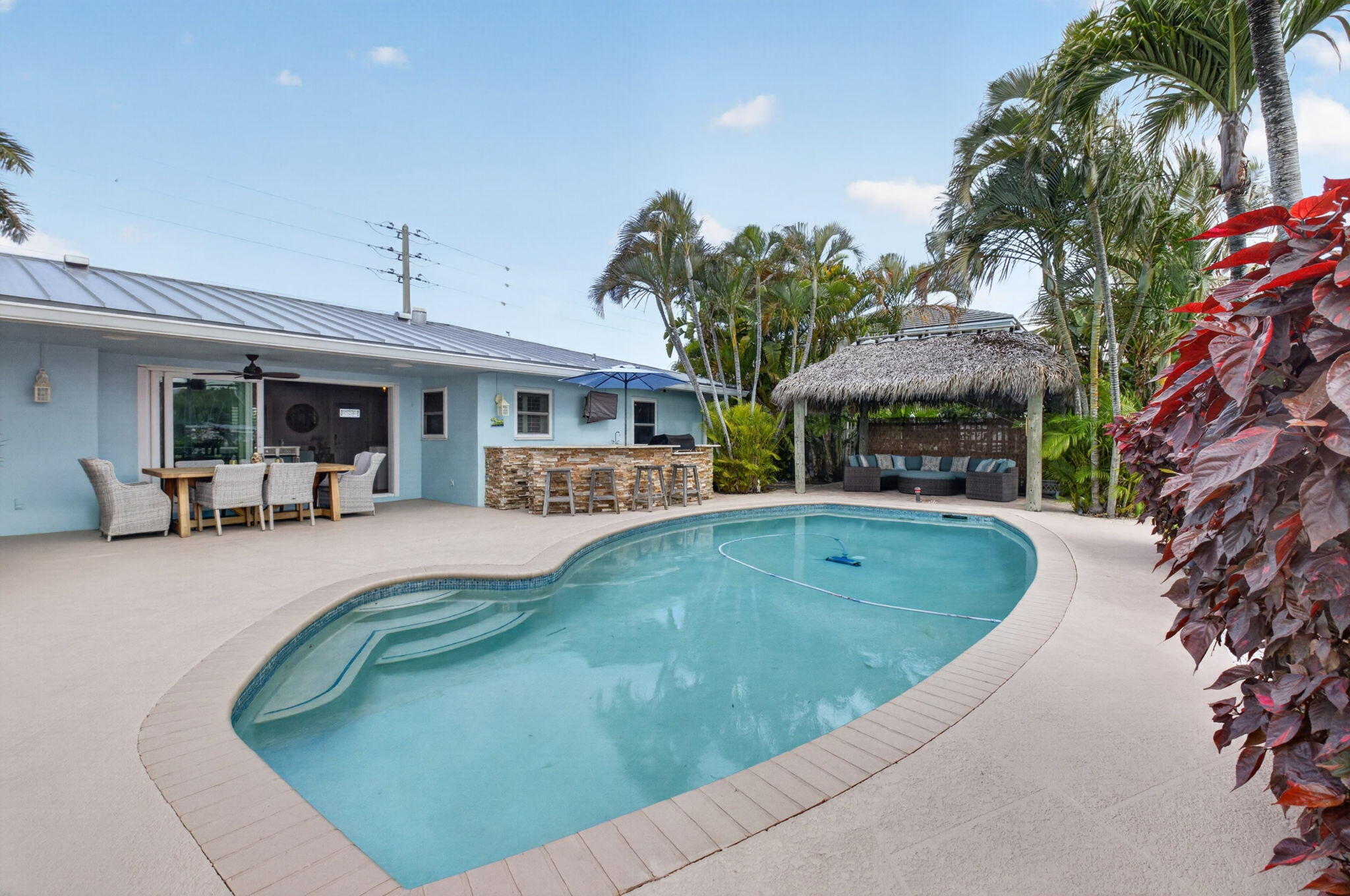 5800 Northeast 7th Avenue Boca Raton, FL 33487 - Photo 39 of 61 a view of a house with swimming pool and sitting area