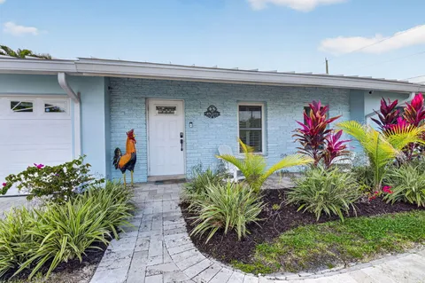 a view of a livingroom with furniture and a window