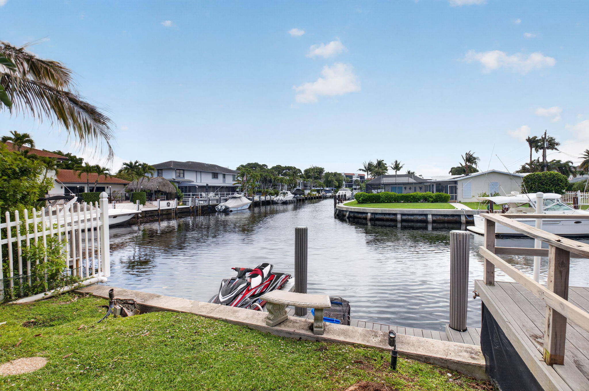 5800 Northeast 7th Avenue Boca Raton, FL 33487 - Photo 42 of 61 a view of a lake with boats and a lawn chairs