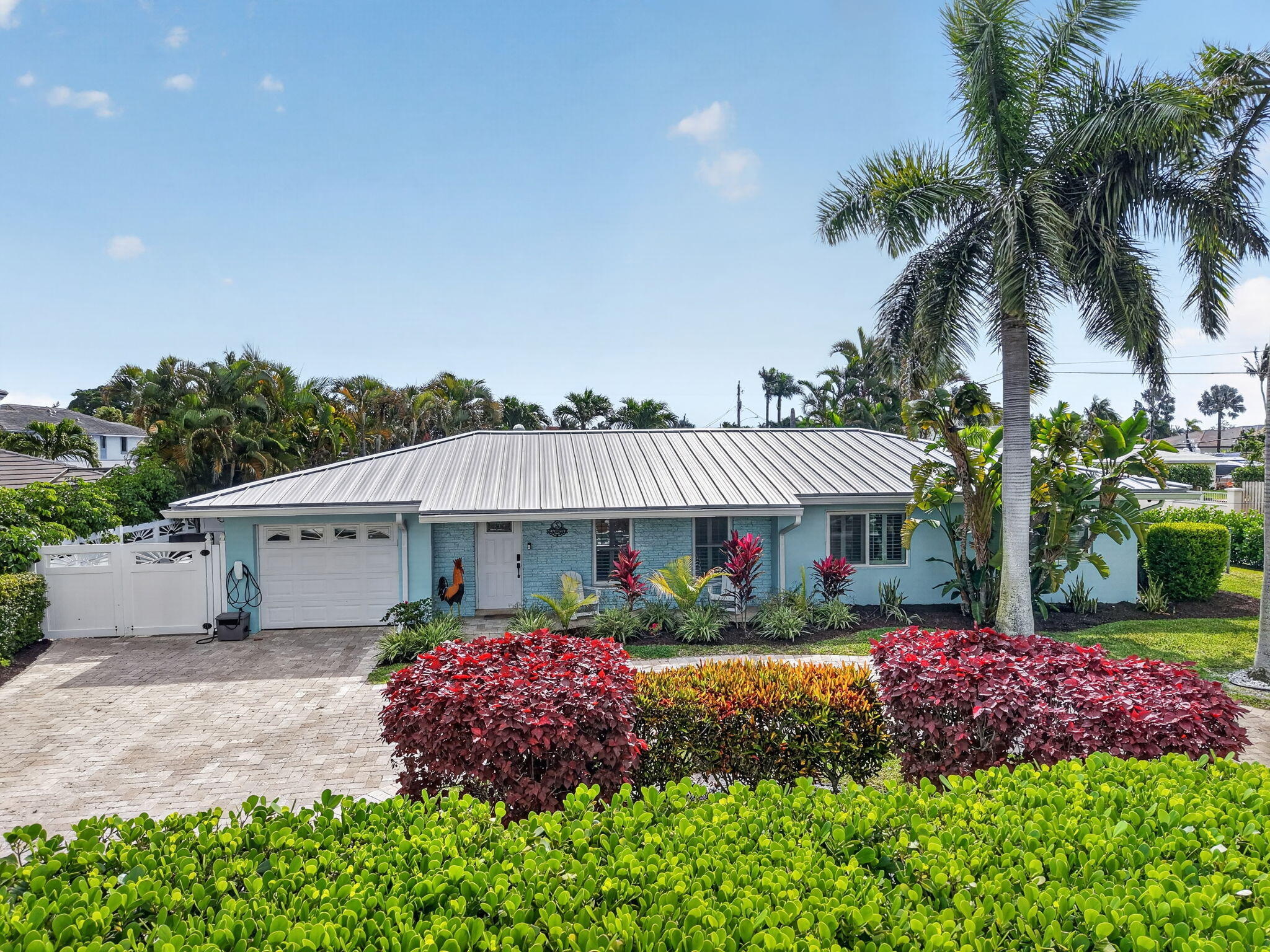 5800 Northeast 7th Avenue Boca Raton, FL 33487 - Photo 46 of 61 a front view of house with a garden