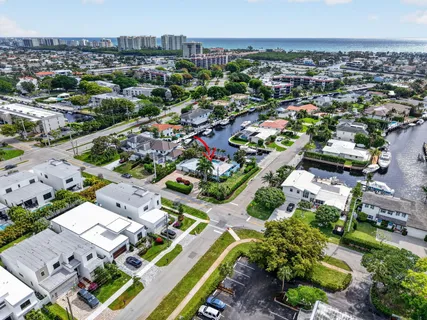 an aerial view of a house with a yard and garden