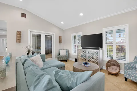 a view of a dining room with furniture large window and wooden floor
