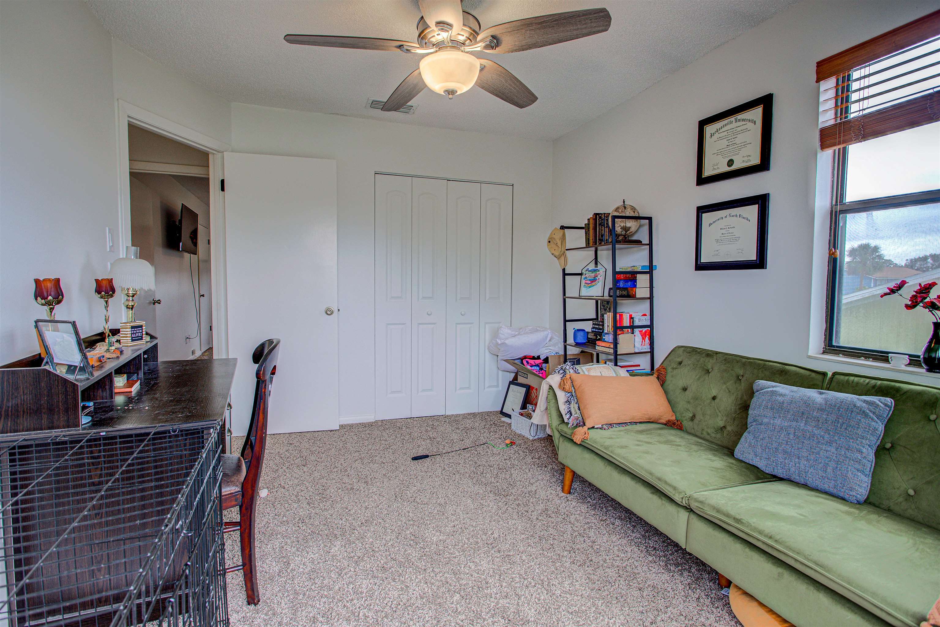 118 Rio Del Mar Street St. Augustine, FL 32080 - Photo 18 of 24 a living room with furniture and flat screen tv