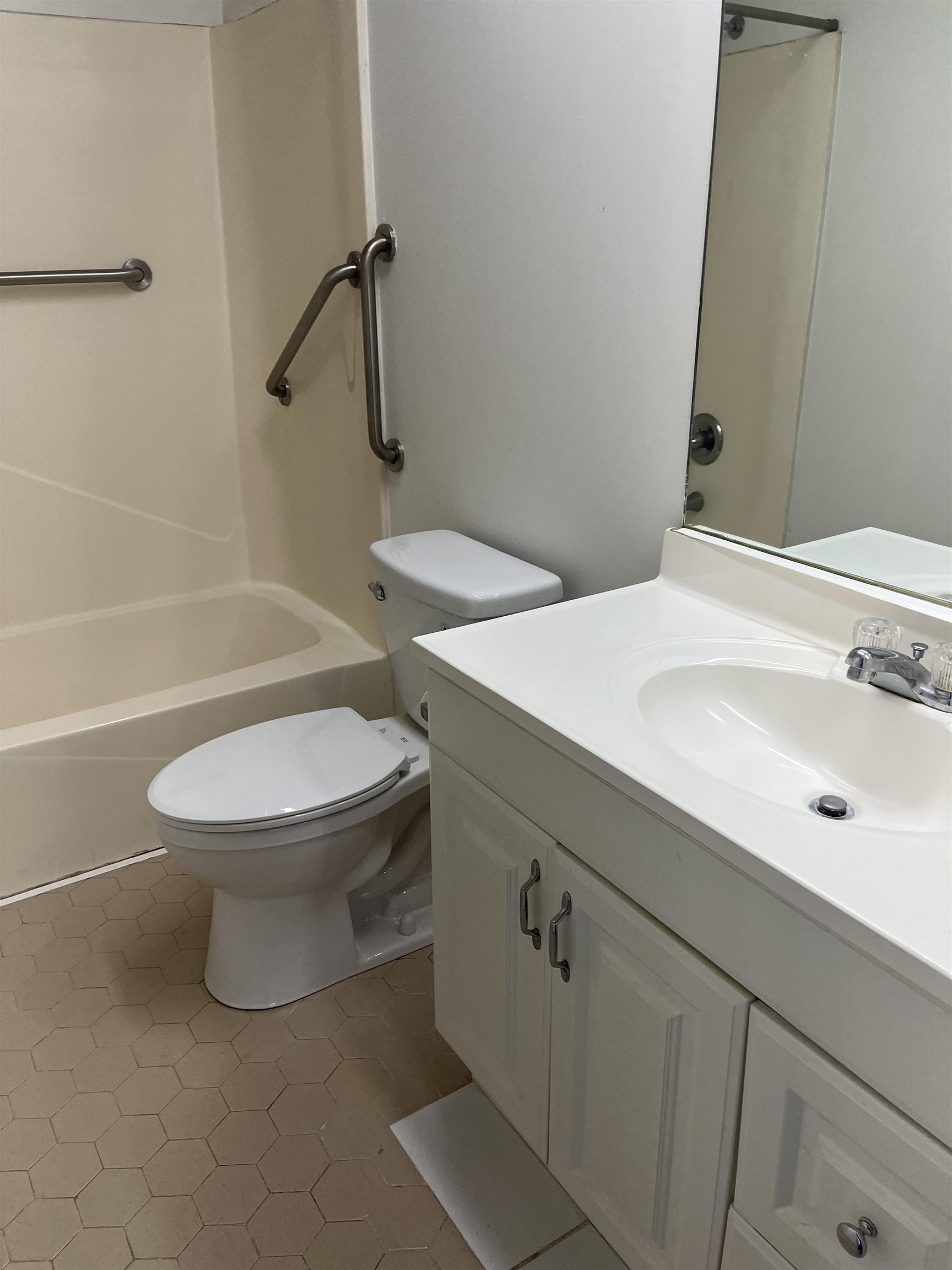 118 Rio Del Mar Street St. Augustine, FL 32080 - Photo 24 of 24 a white toilet sitting next to a bathroom sink