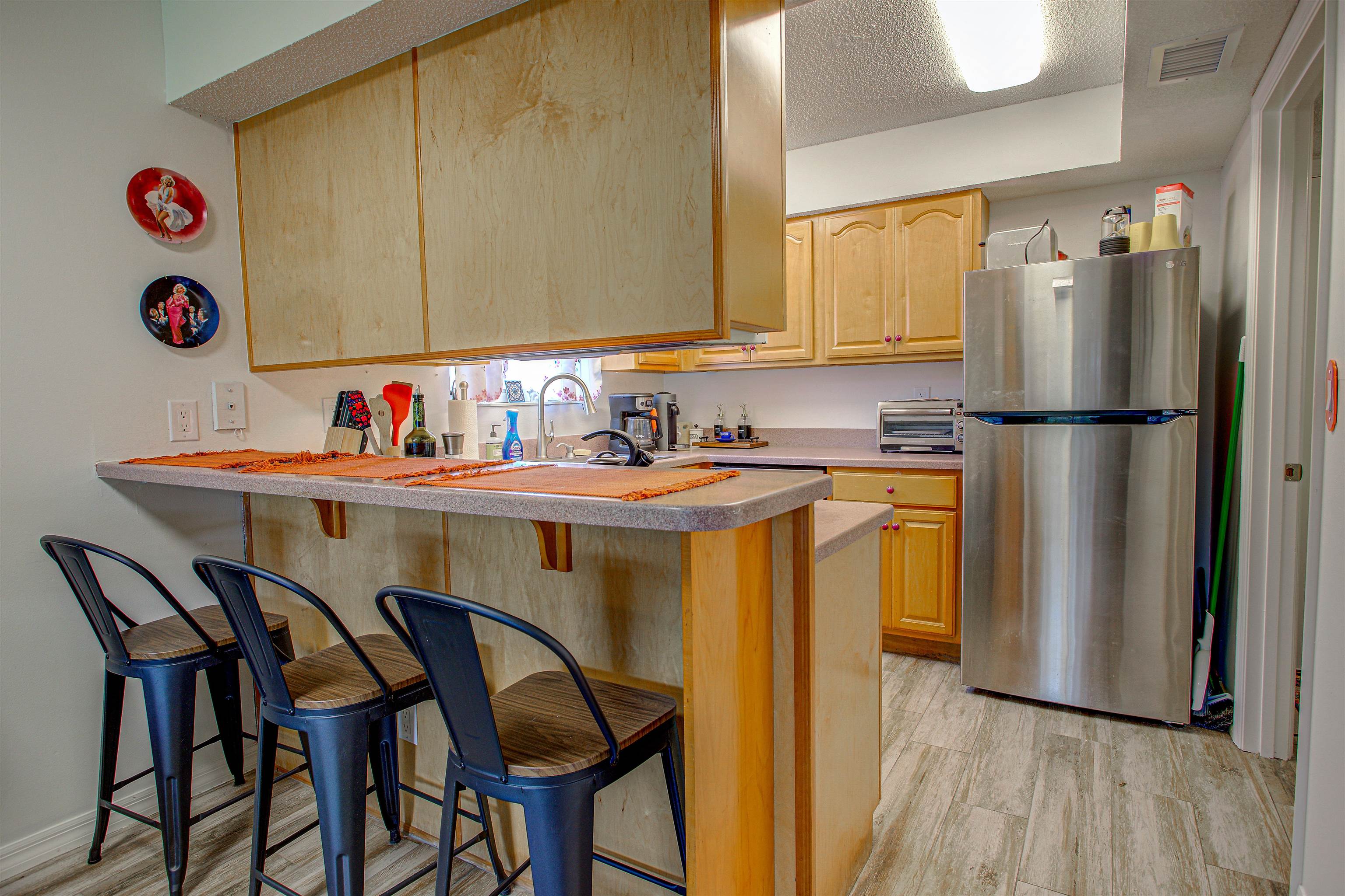 118 Rio Del Mar Street St. Augustine, FL 32080 - Photo 6 of 24 a kitchen with appliances cabinets and wooden floor