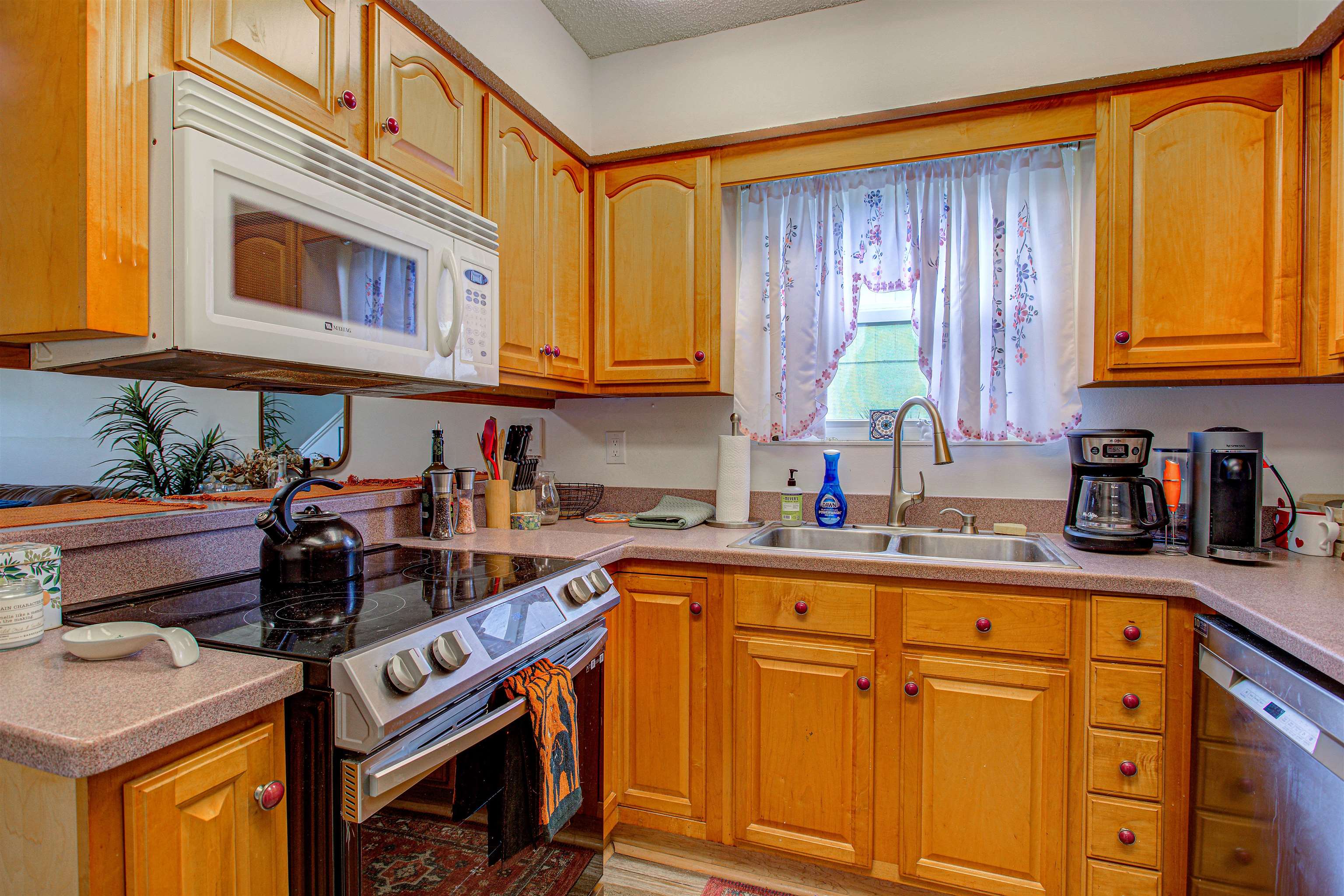 118 Rio Del Mar Street St. Augustine, FL 32080 - Photo 8 of 24 a kitchen with stainless steel appliances granite countertop a sink a stove and cabinets