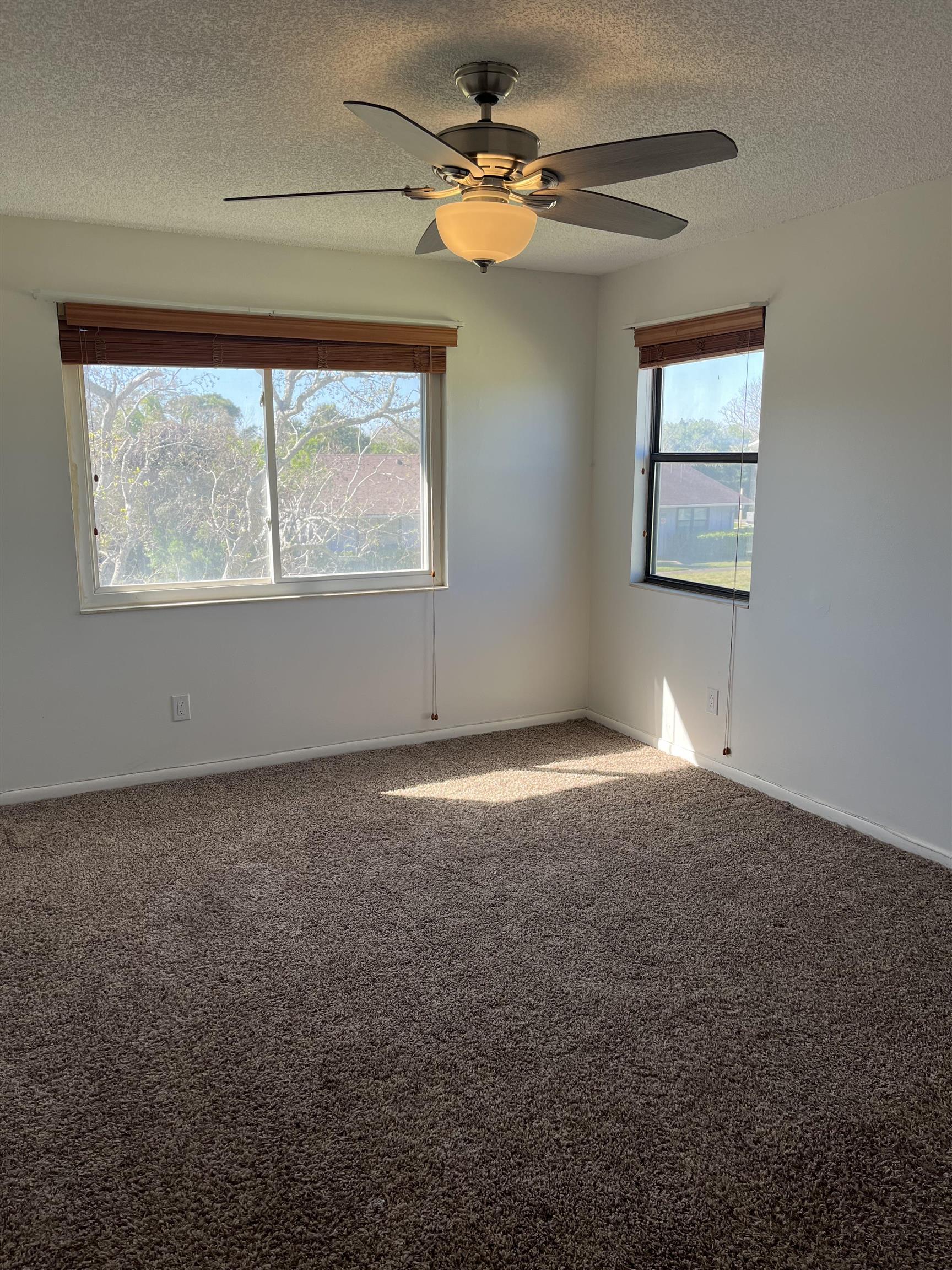 118 Rio Del Mar Street St. Augustine, FL 32080 - Photo 10 of 24 an empty room with windows and fan