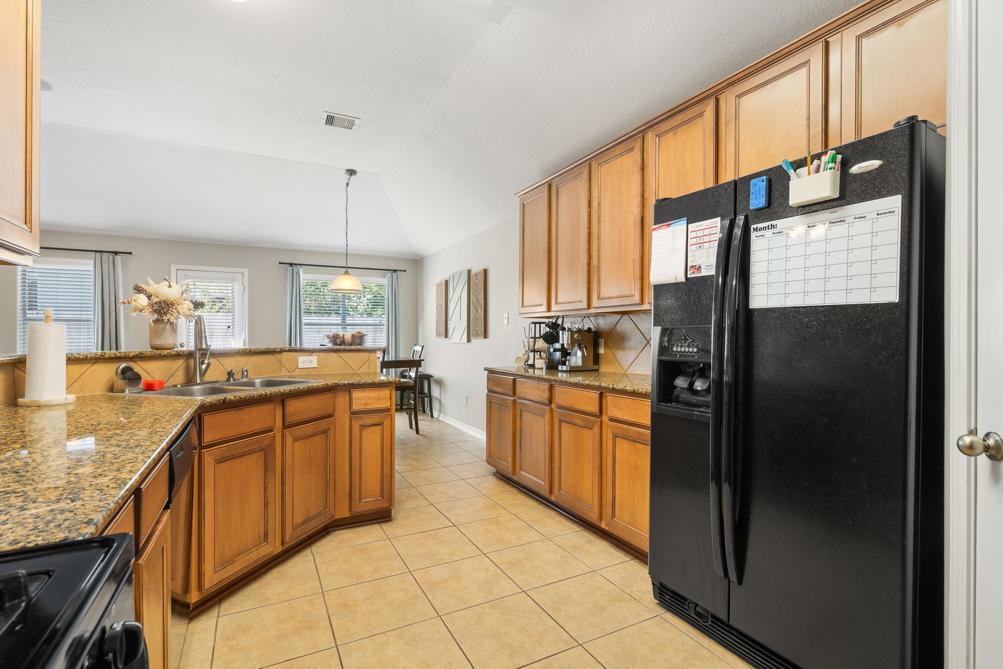 20903 Manon Lane Spring, TX 77388 - Photo 12 of 31 a large kitchen with stainless steel appliances granite countertop a refrigerator a oven and a sink