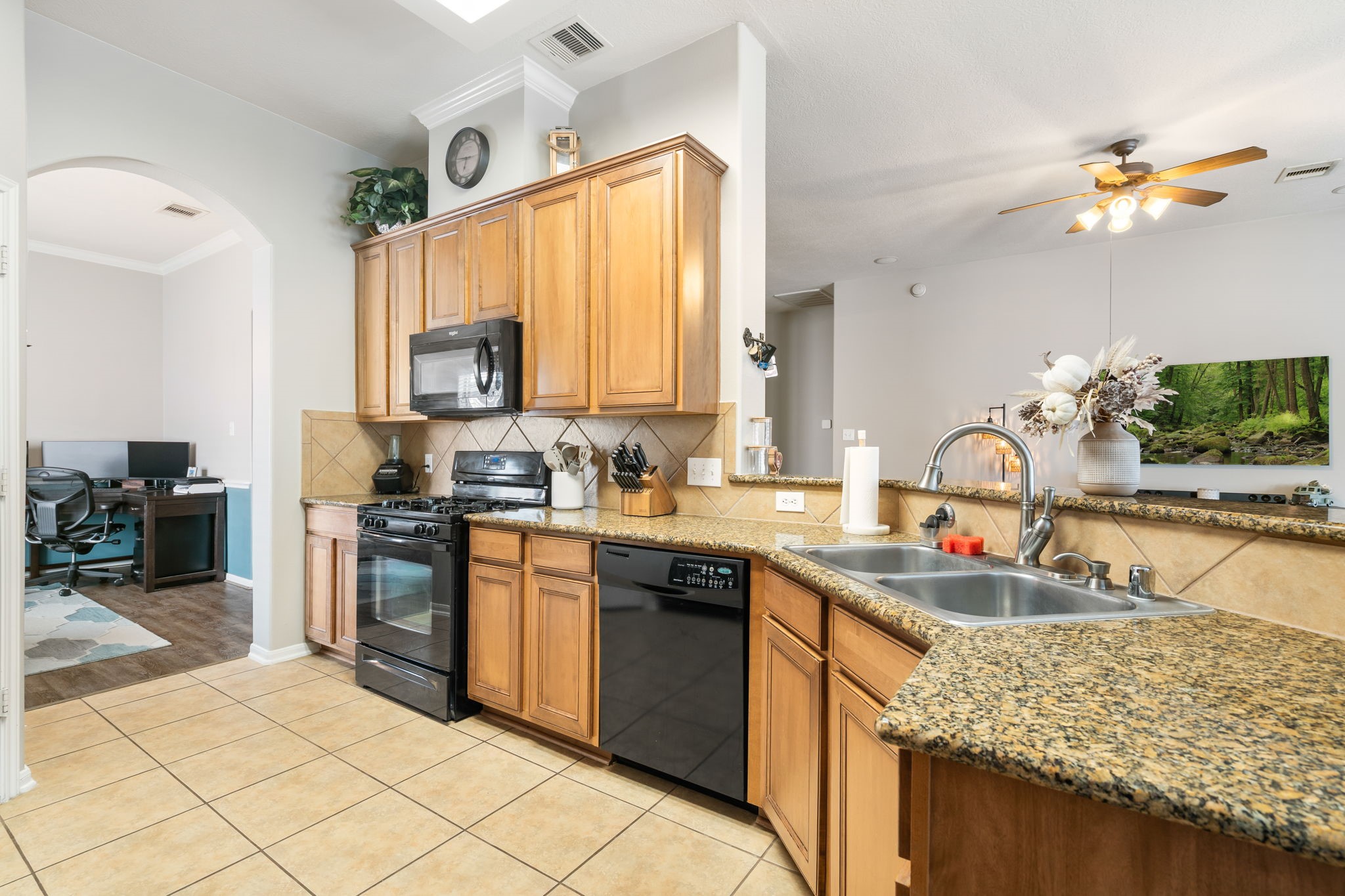 20903 Manon Lane Spring, TX 77388 - Photo 15 of 31 a kitchen with stainless steel appliances granite countertop a sink stove and refrigerator