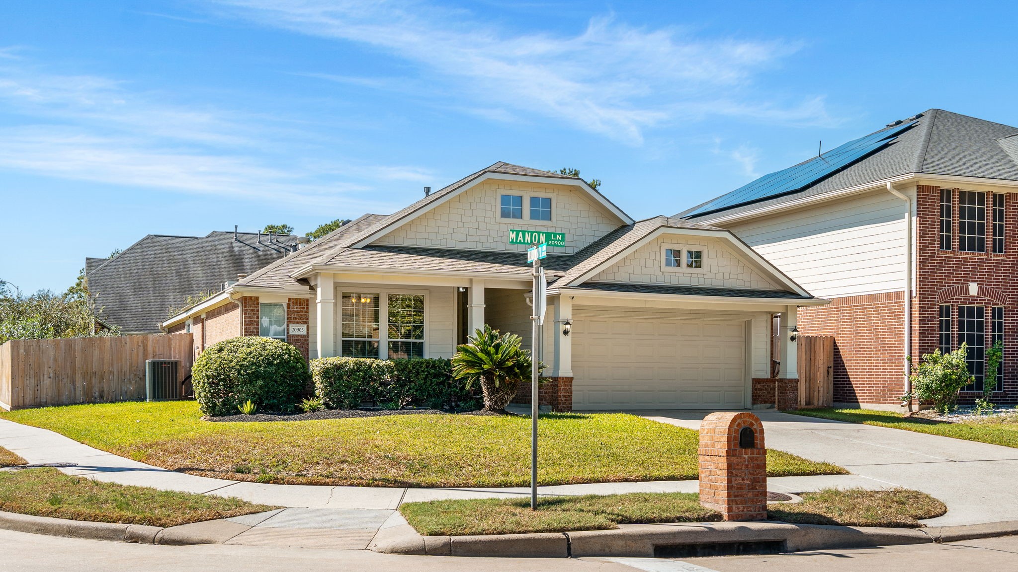 20903 Manon Lane Spring, TX 77388 - Photo 2 of 31 a front view of a house with a garden