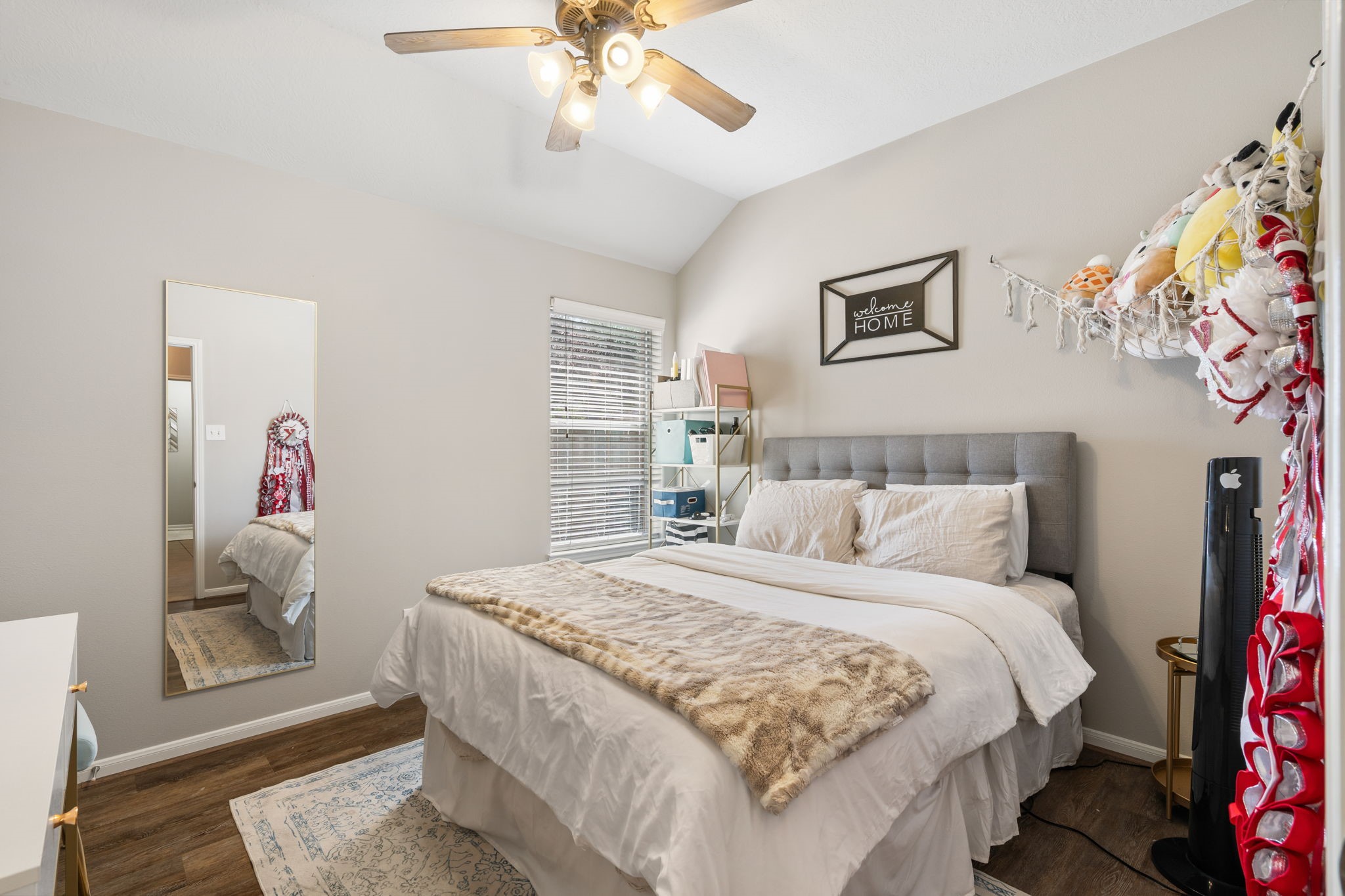 20903 Manon Lane Spring, TX 77388 - Photo 24 of 31 a bedroom with a bed and a chandelier