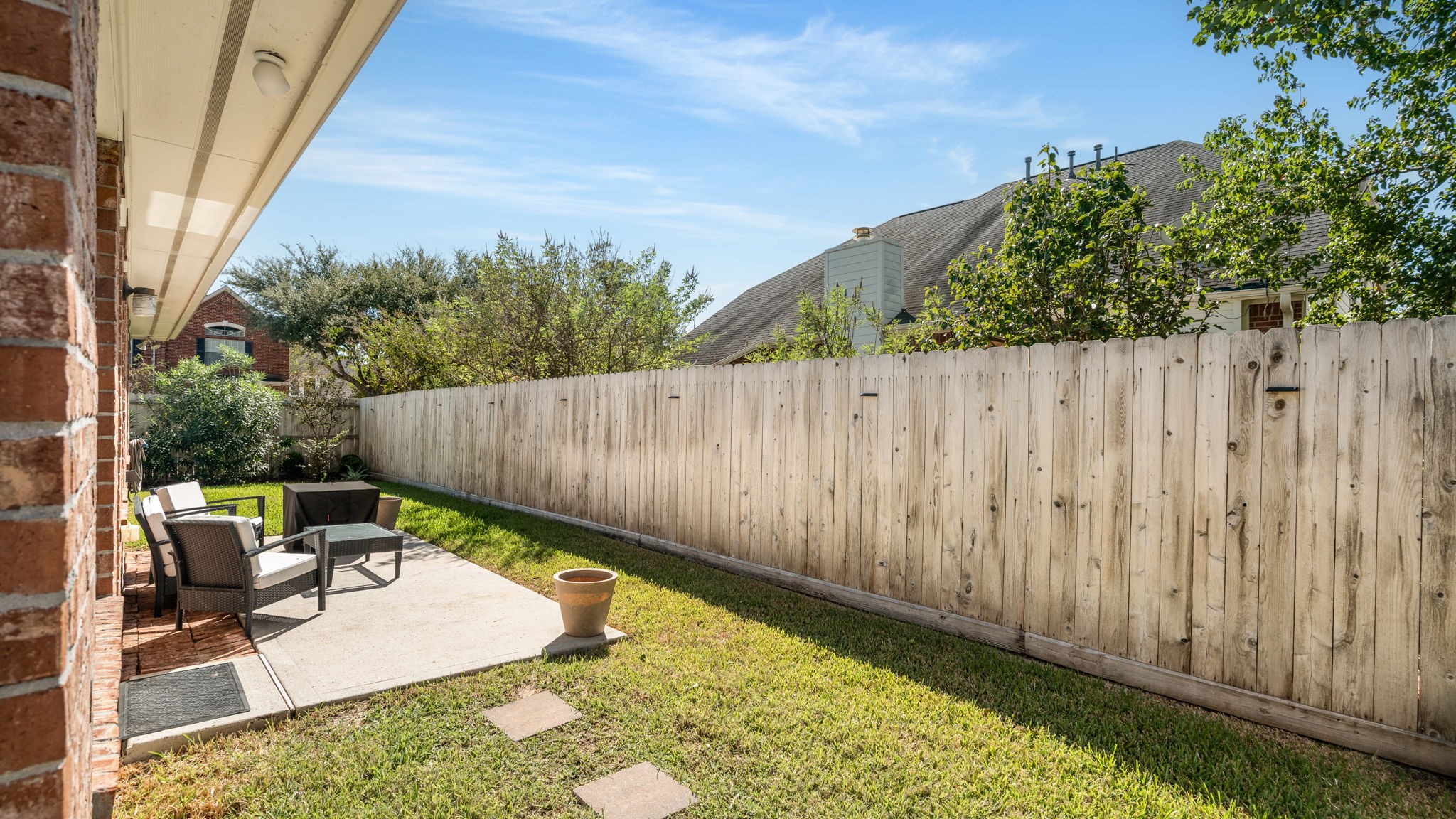20903 Manon Lane Spring, TX 77388 - Photo 30 of 31 a view of a backyard with chair and table